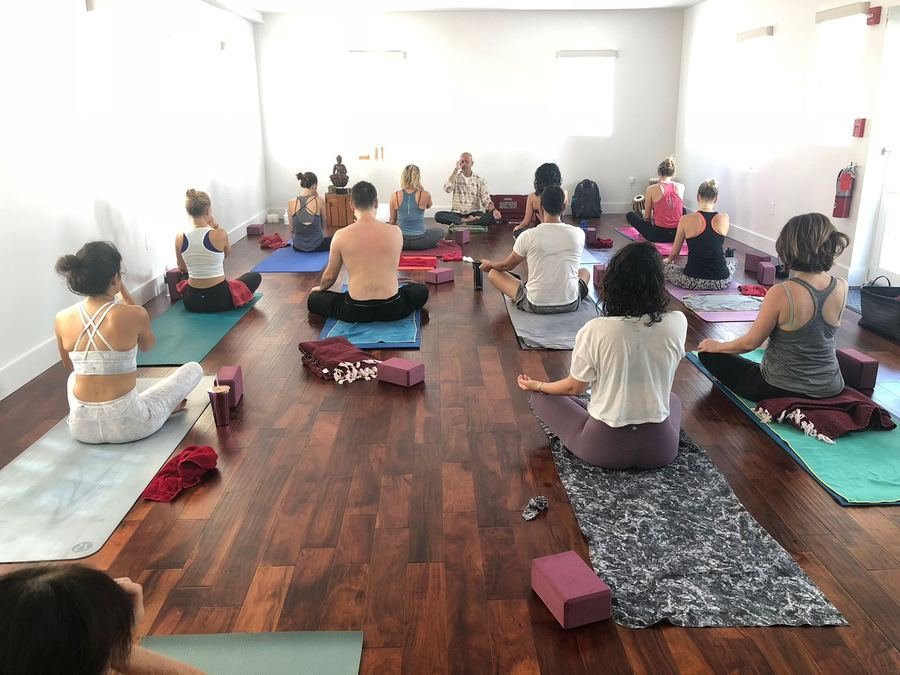 Prashant leading a seated meditation class