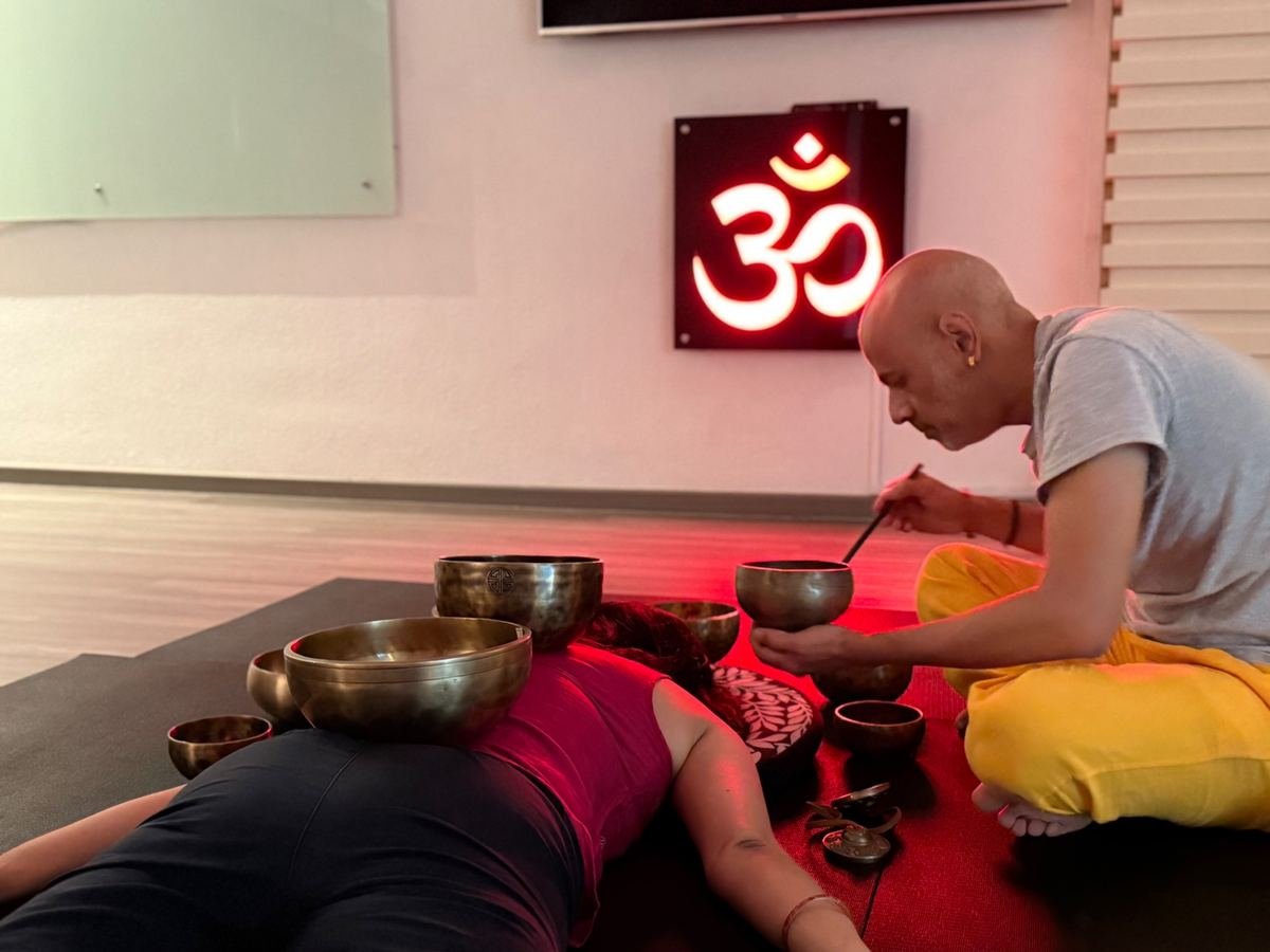 Prashant giving a singing bowl therapy session